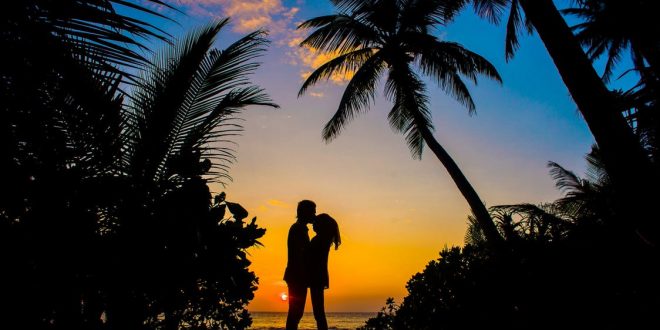 Silhouette of Man and Woman Kissing