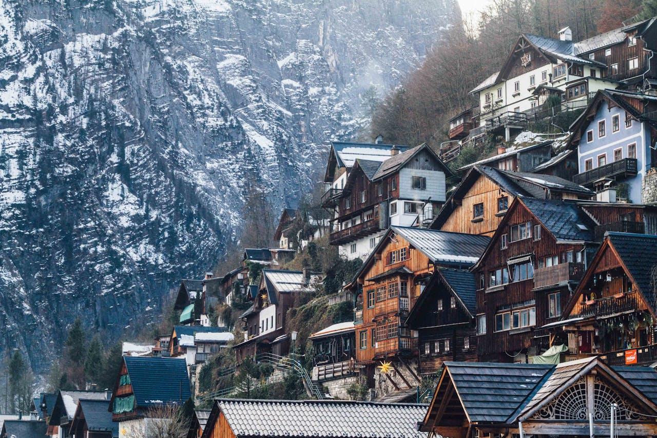 Assorted wooden-colored houses on a mountain.